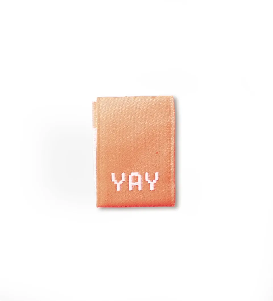 paul-clara-weblabels-klapp-weblabel-yay-neoncoral-n-hetikett image 1