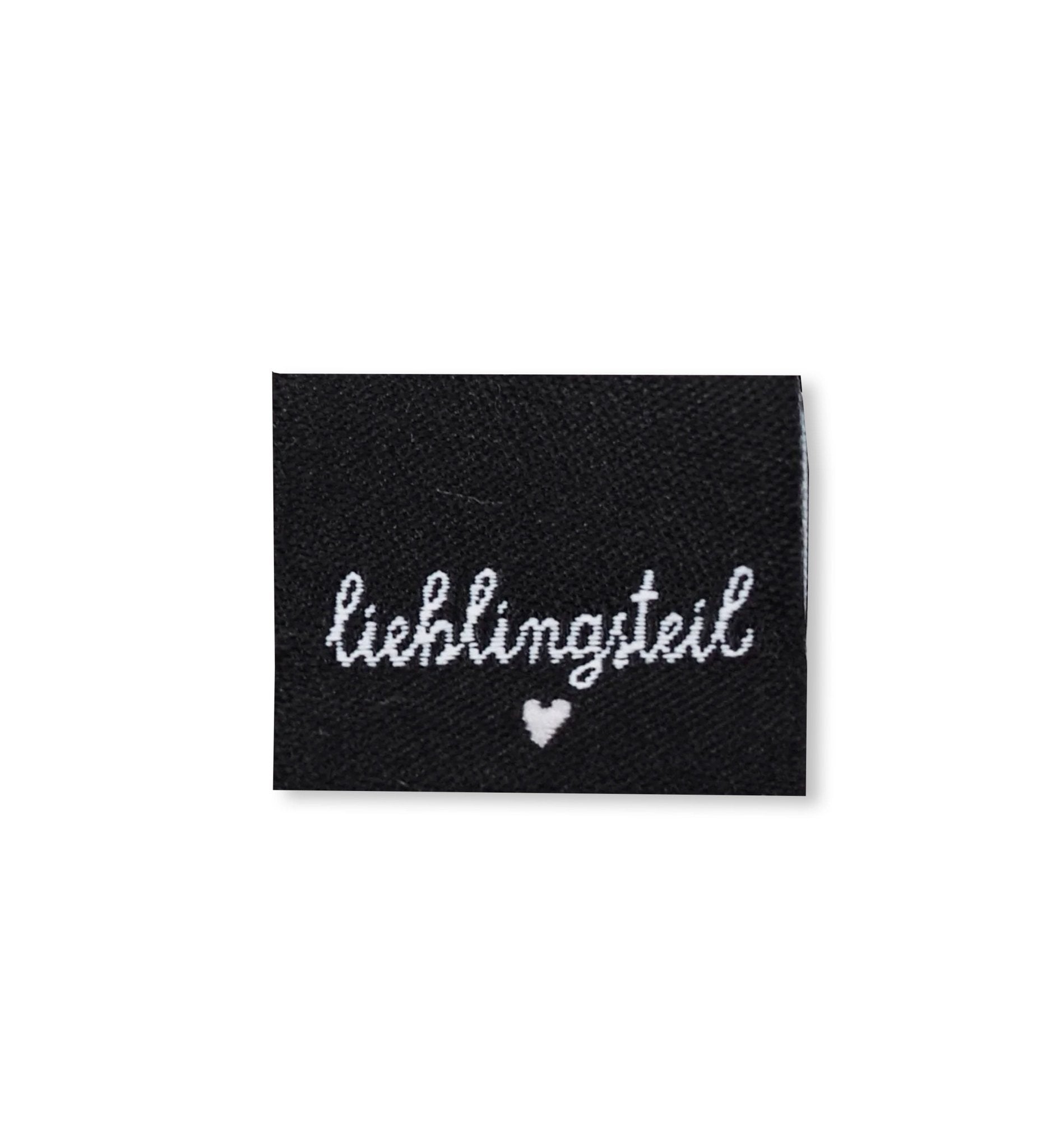 paul-clara-weblabels-lieblingsteil-schwarz-klapp-label-kotex image 1