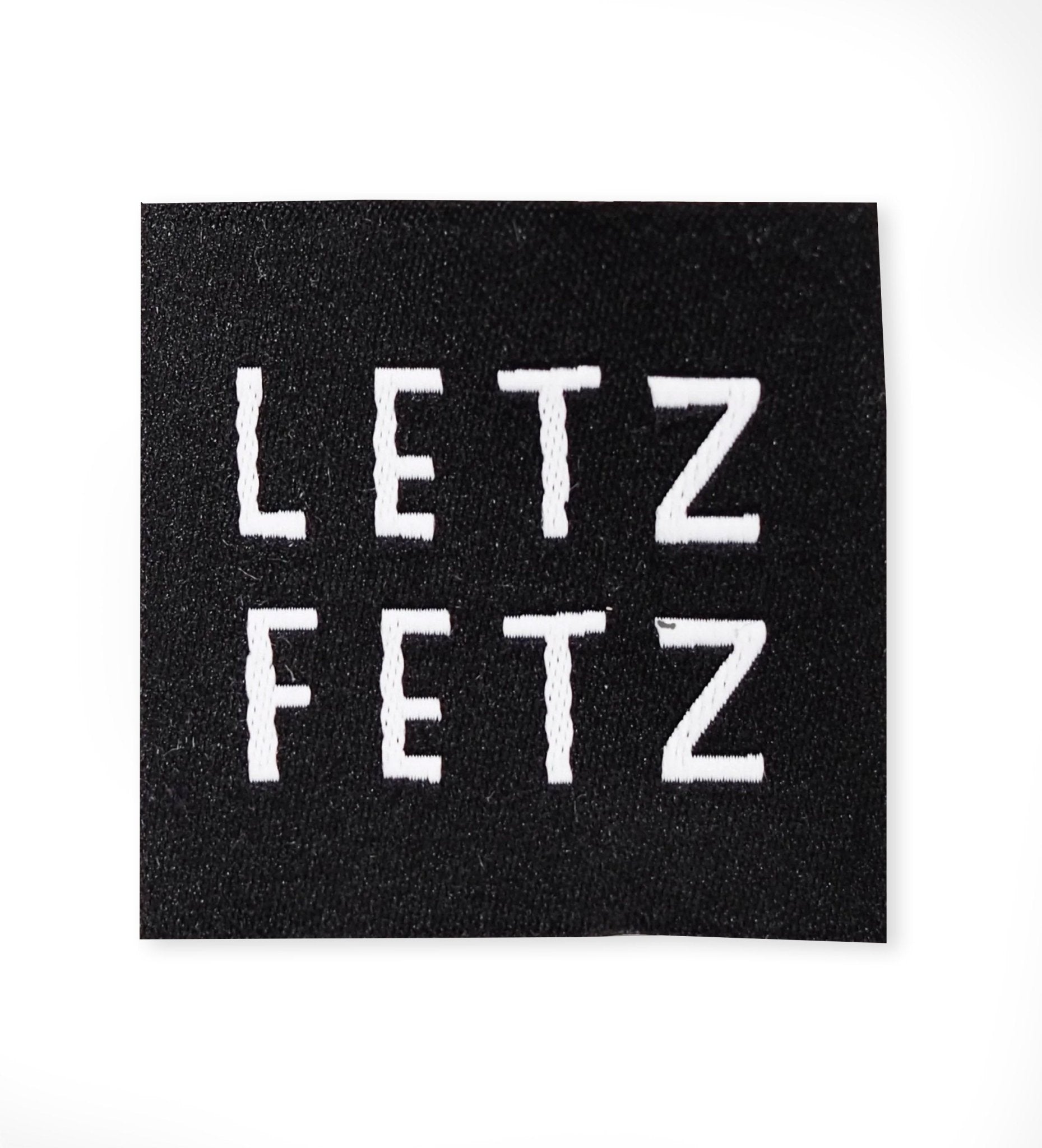 paul-clara-weblabels-letz-fetz-schwarz-weblabel-gewebt image 1