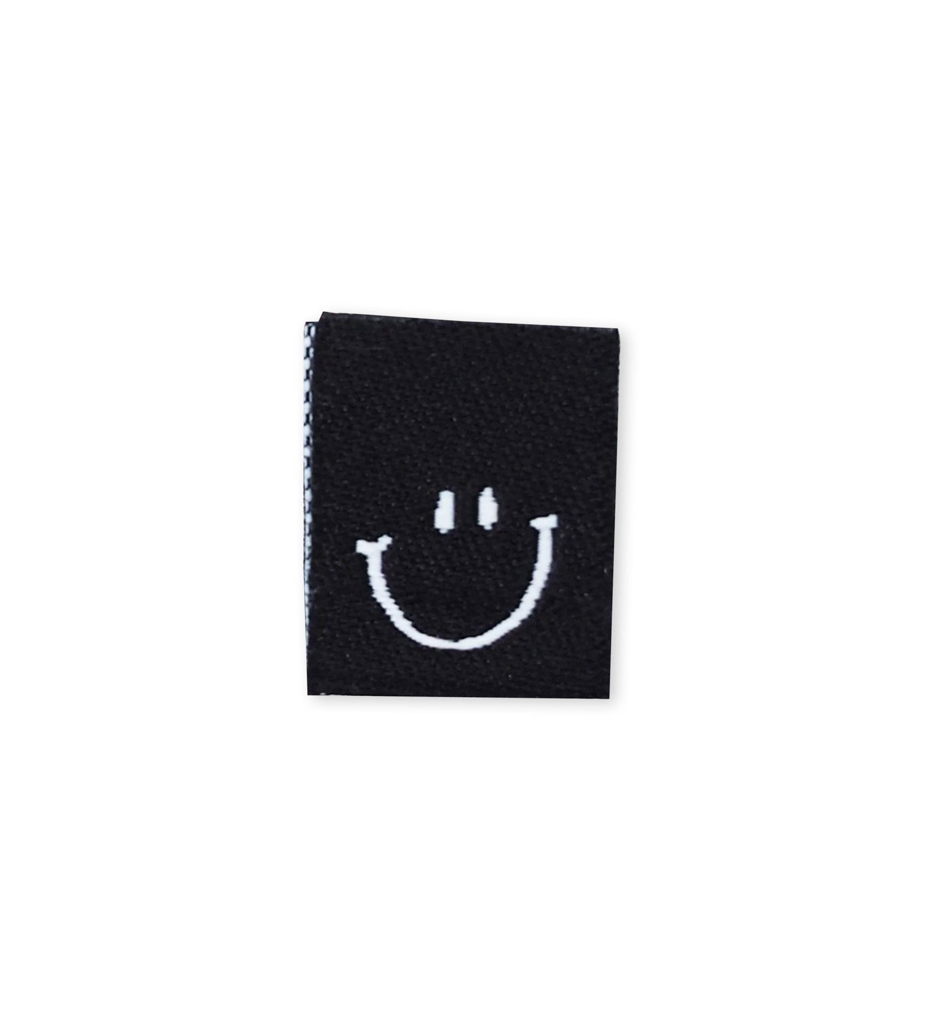 paul-clara-weblabels-smile-klapp-weblabel-schwarz-ko-tex image 1